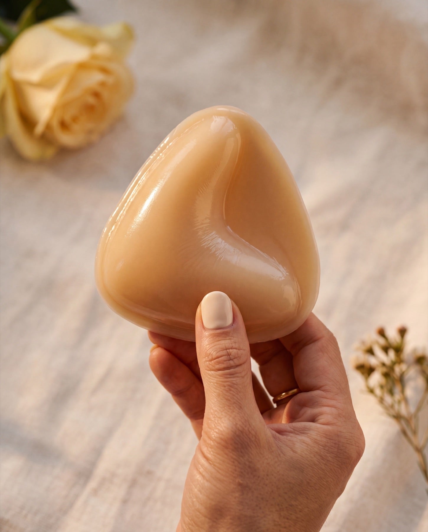 Nubare adhesive bra insert — single piece, palm-sized scale